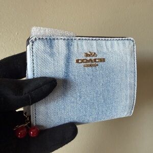 SOLD. Coach loved denim wallet with charm. Authentic. NWT